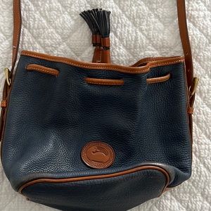 Vintage Dooney & Burke bucket bag with crossbody/shoulder strap.